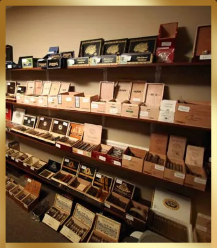 A wide shot of multiple wooden shelves filled with various open and closed cigar boxes in a retail setting. The boxes are stacked and arranged, showcasing a large inventory of cigars.