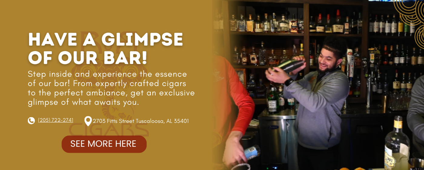 Bartender mixing a cocktail behind a well-stocked bar at RandR Cigars Lounge in Tuscaloosa, Alabama, inviting guests to experience the bar’s ambiance and cigar pairing.